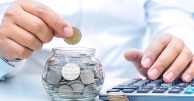 Calculator with coin in jar