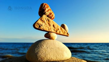 4 stons balancing in the ocean